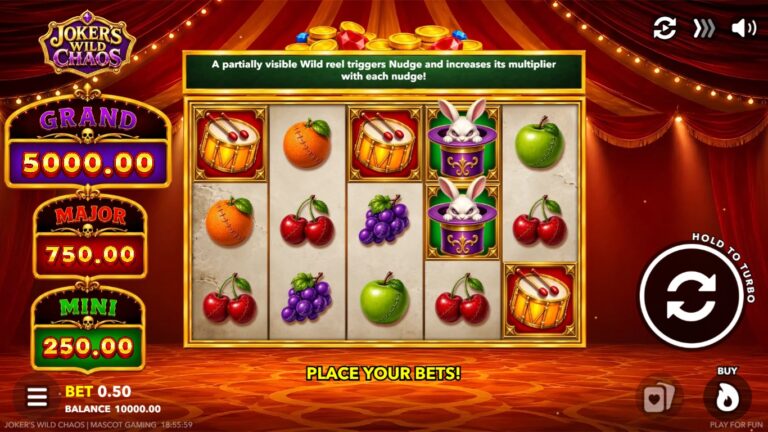 Joker's Wild Chaos slot gameplay with fruit symbols and a circus-style reel cabinet