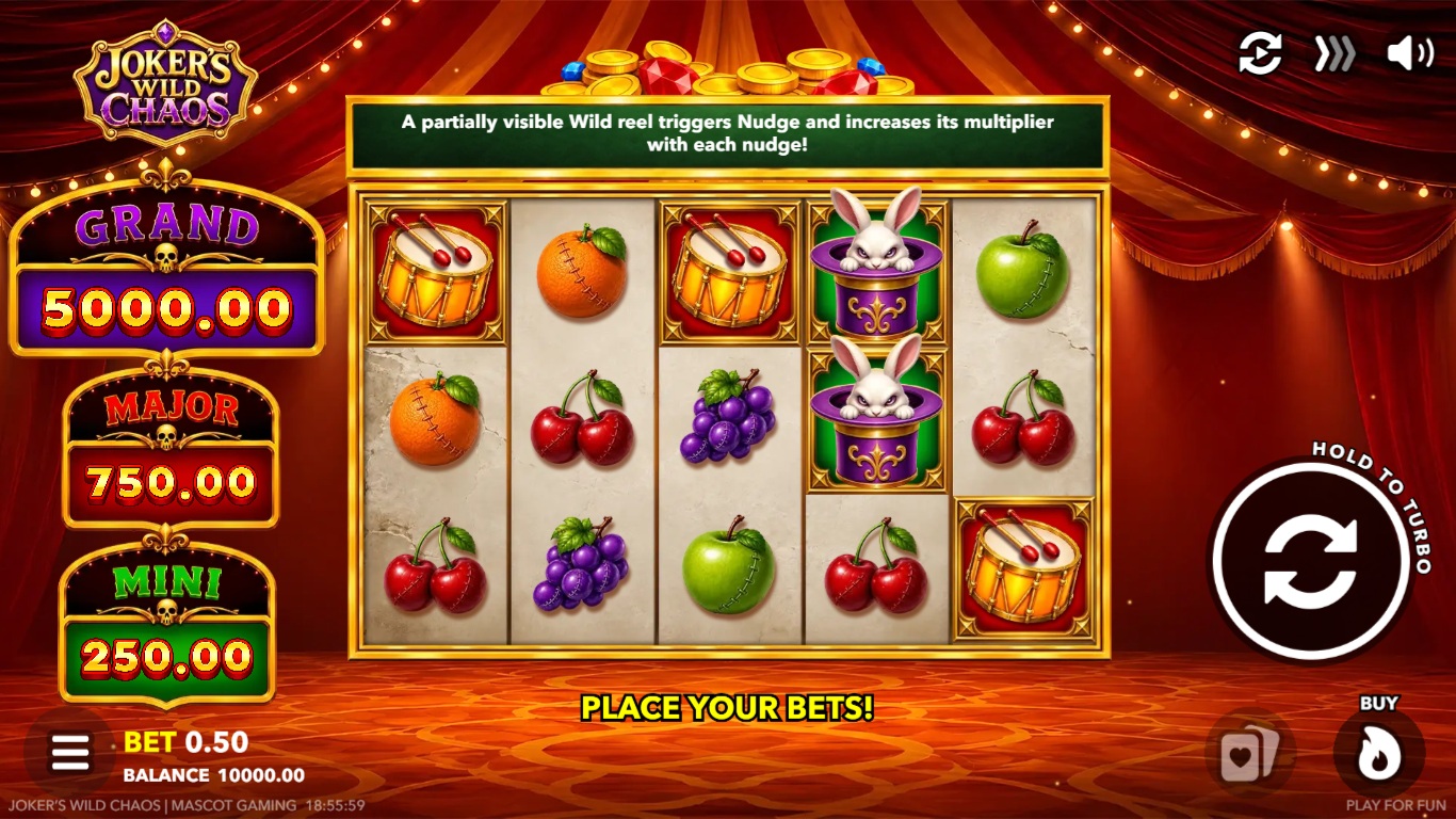 Joker's Wild Chaos slot gameplay with fruit symbols and a circus-style reel cabinet